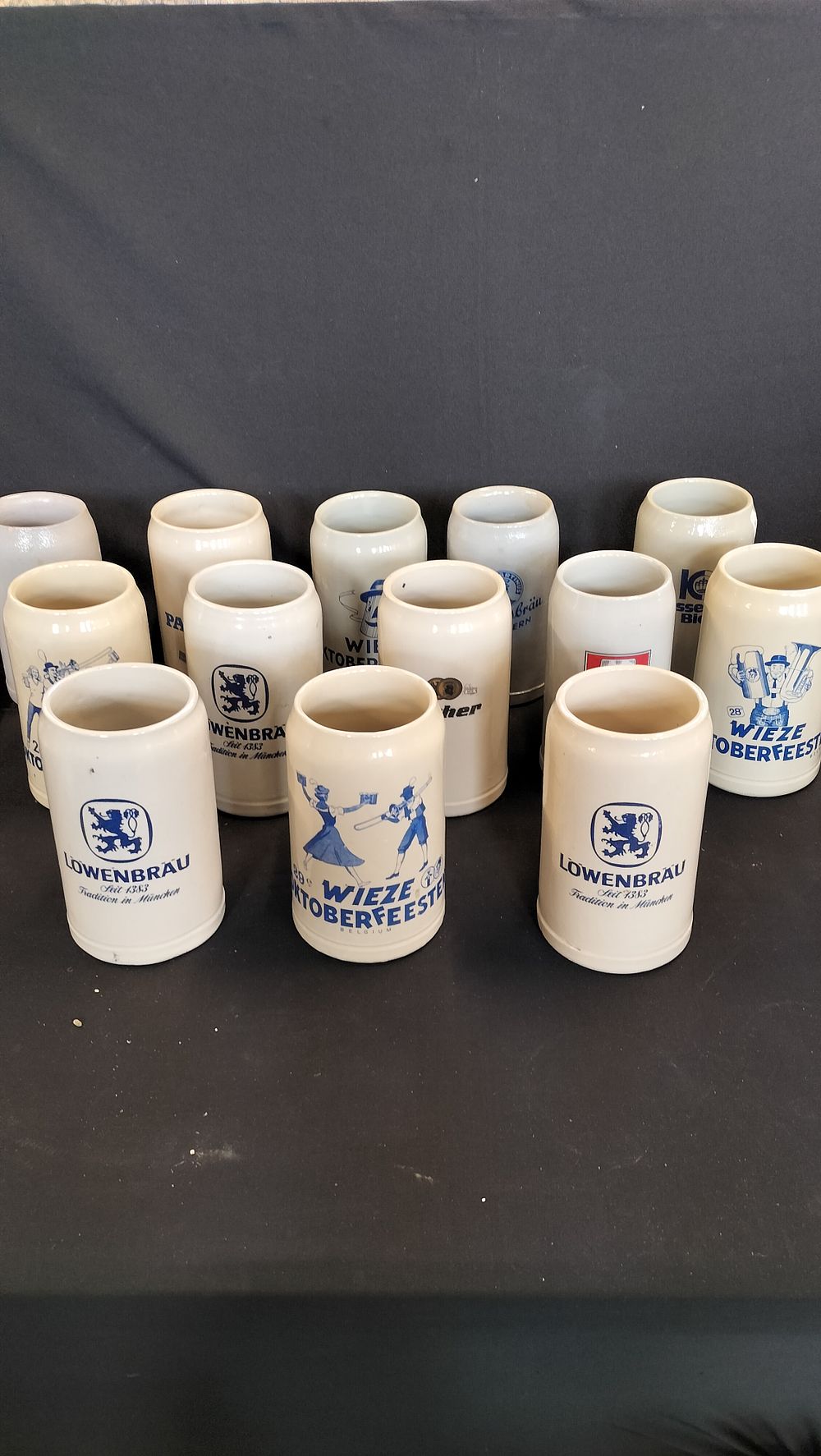 Lot 654: 13 German stoneware steins from various Oktoberfests 