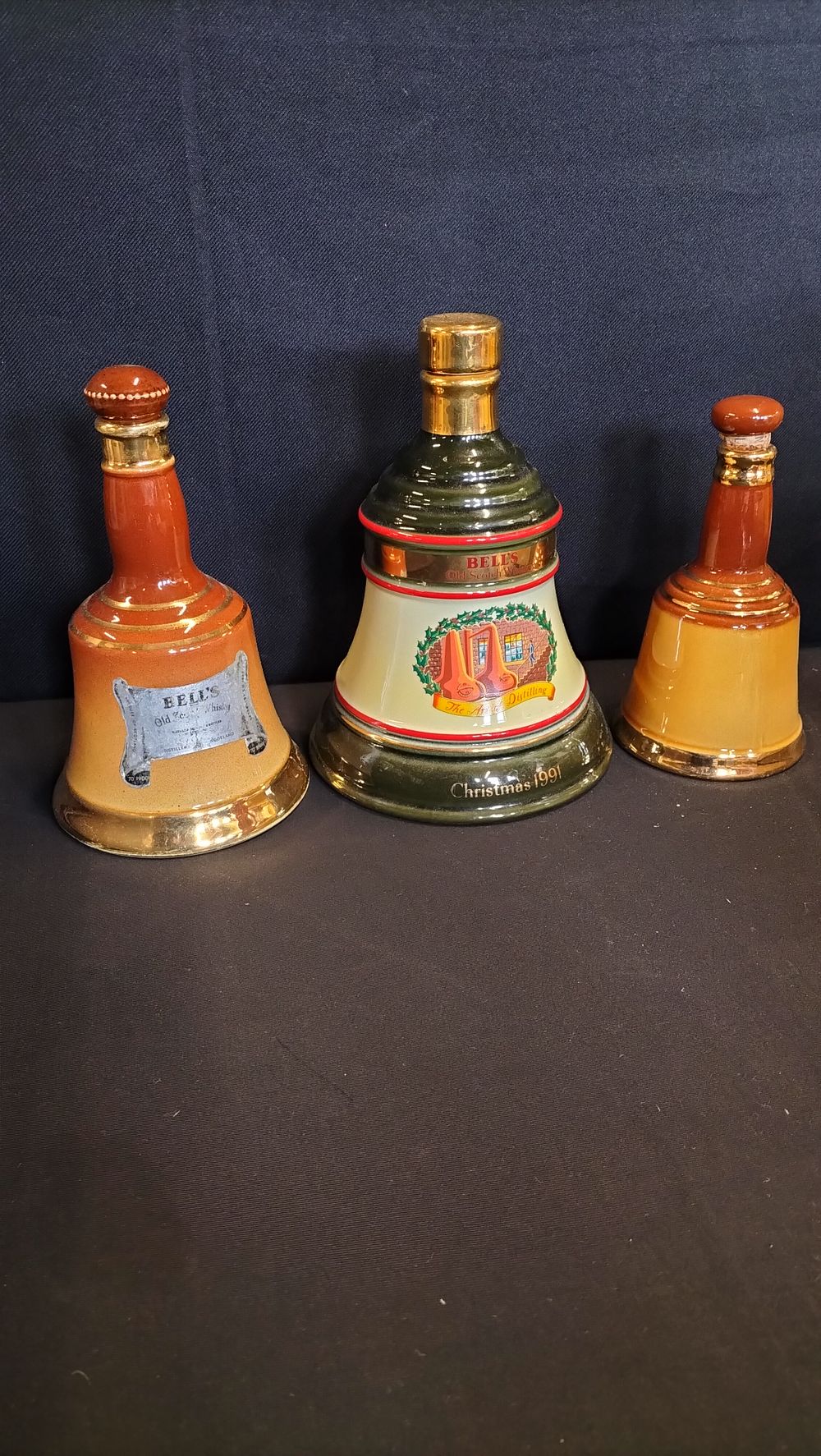 Lot 655: Three Wade decanters, Bell's Christmas 1991, and two...