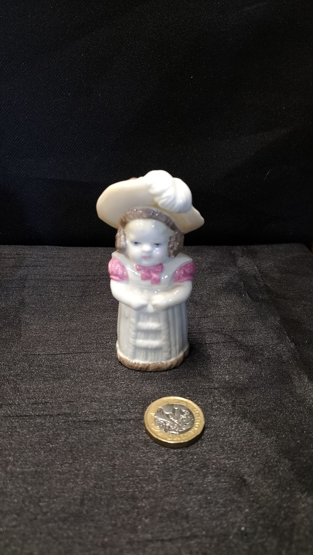 Lot 678: Royal Worcester porcelain feathered hat figurine 