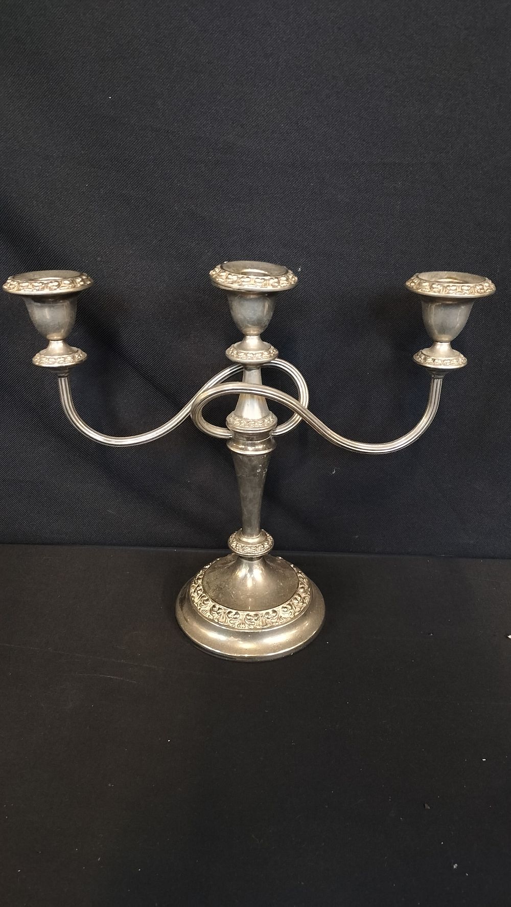 Lot 687: Silver plated three arm candleabra 