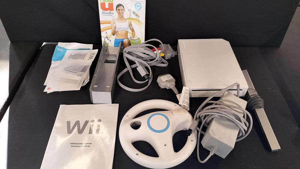 Lot 704: Wii console and Wii fit, and some accessories...
