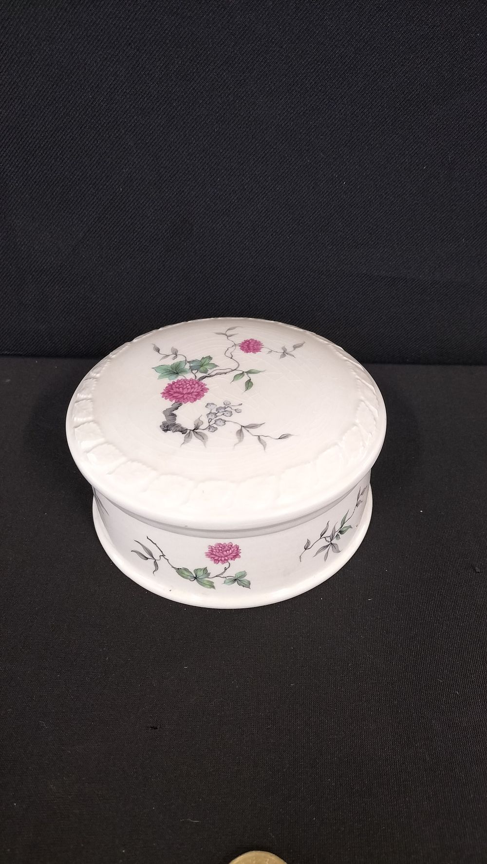 Lot 706: St. Micheals dusting powder pot with floral decoration 