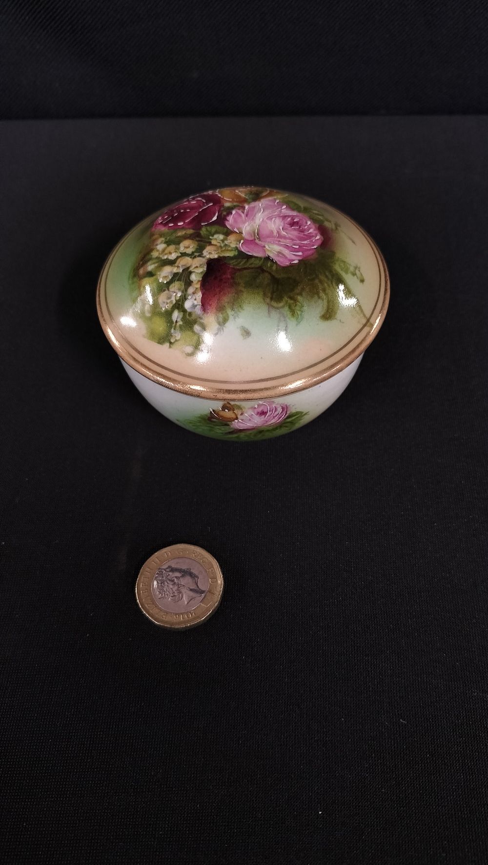 Lot 714: Hand painted porcelain trinket dish with lid decorated...