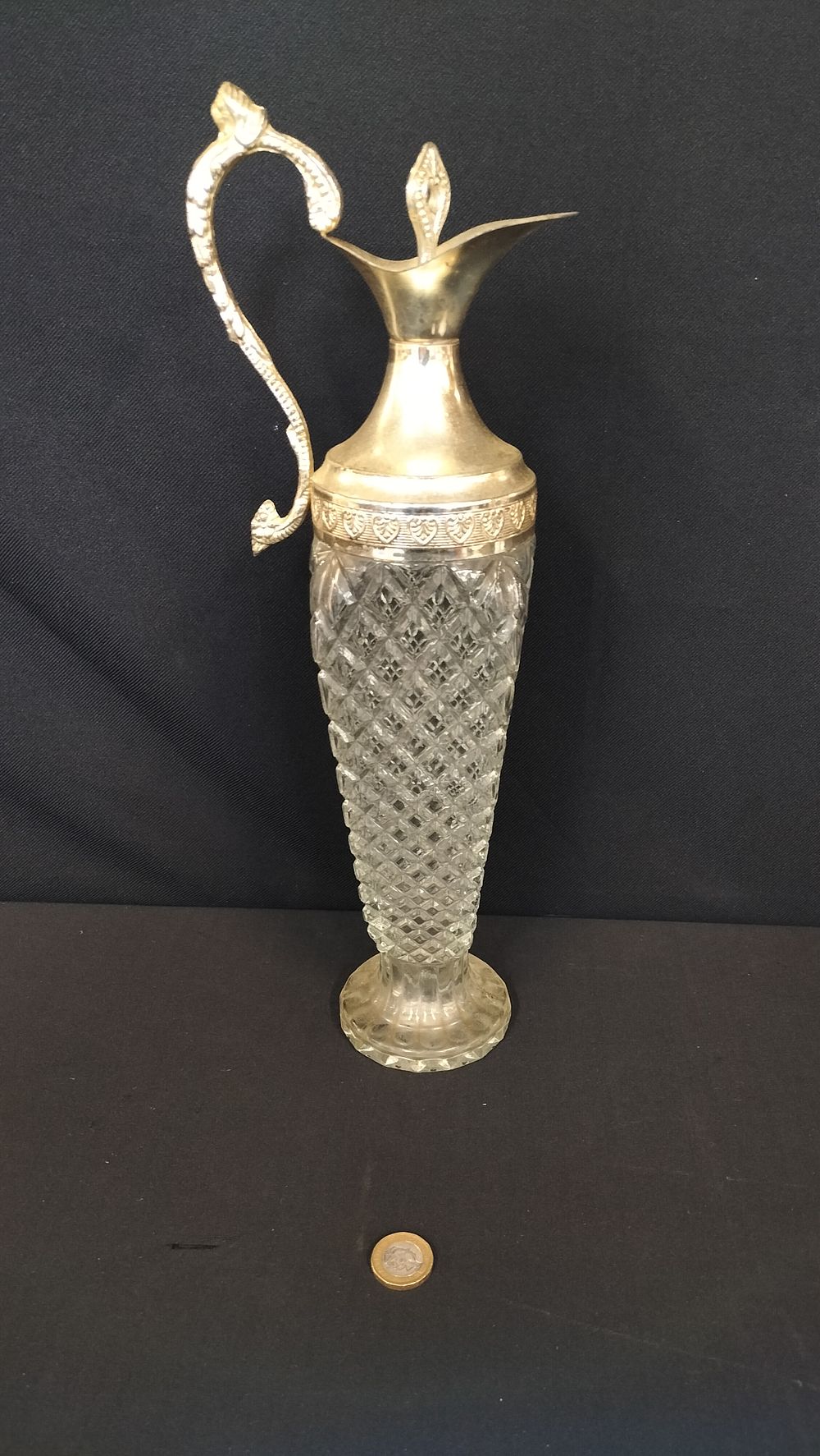 Lot 715: Cut crystal decanter with silver plated top. Measures...