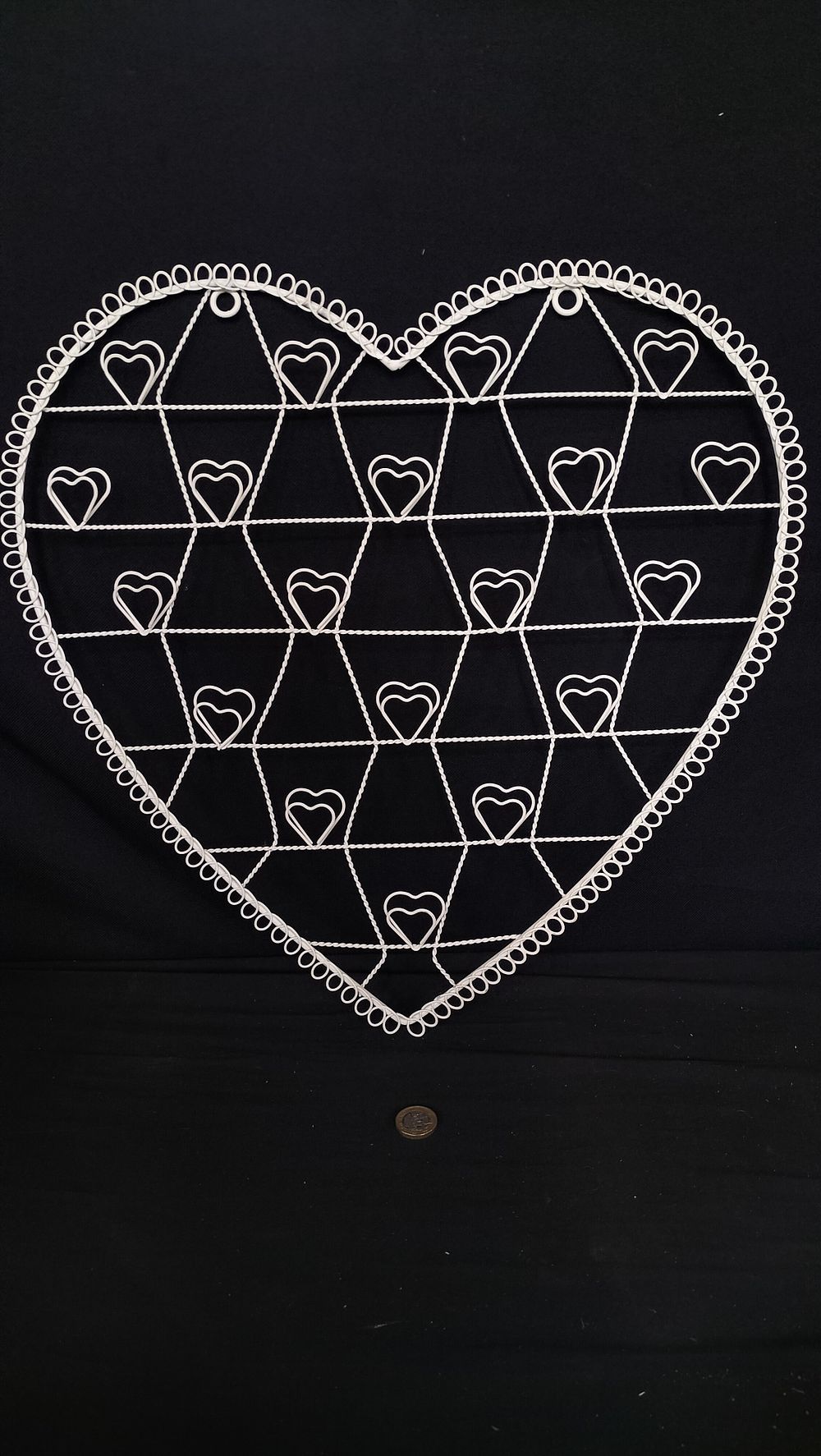 Lot 745: White heart shaped metal jewellery holder 