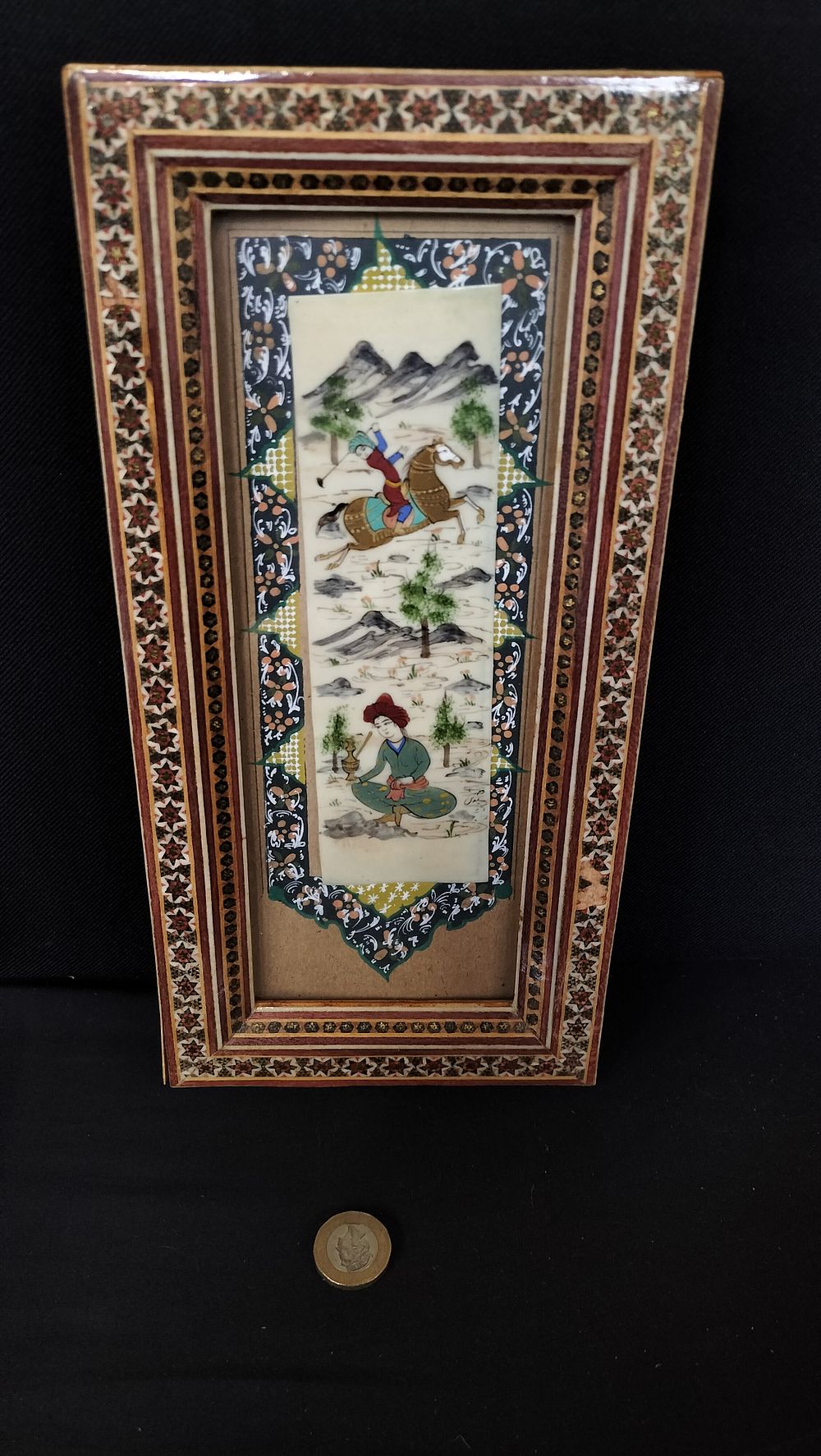 Lot 760: Oriental image in a marqitry frame. Measures approx...