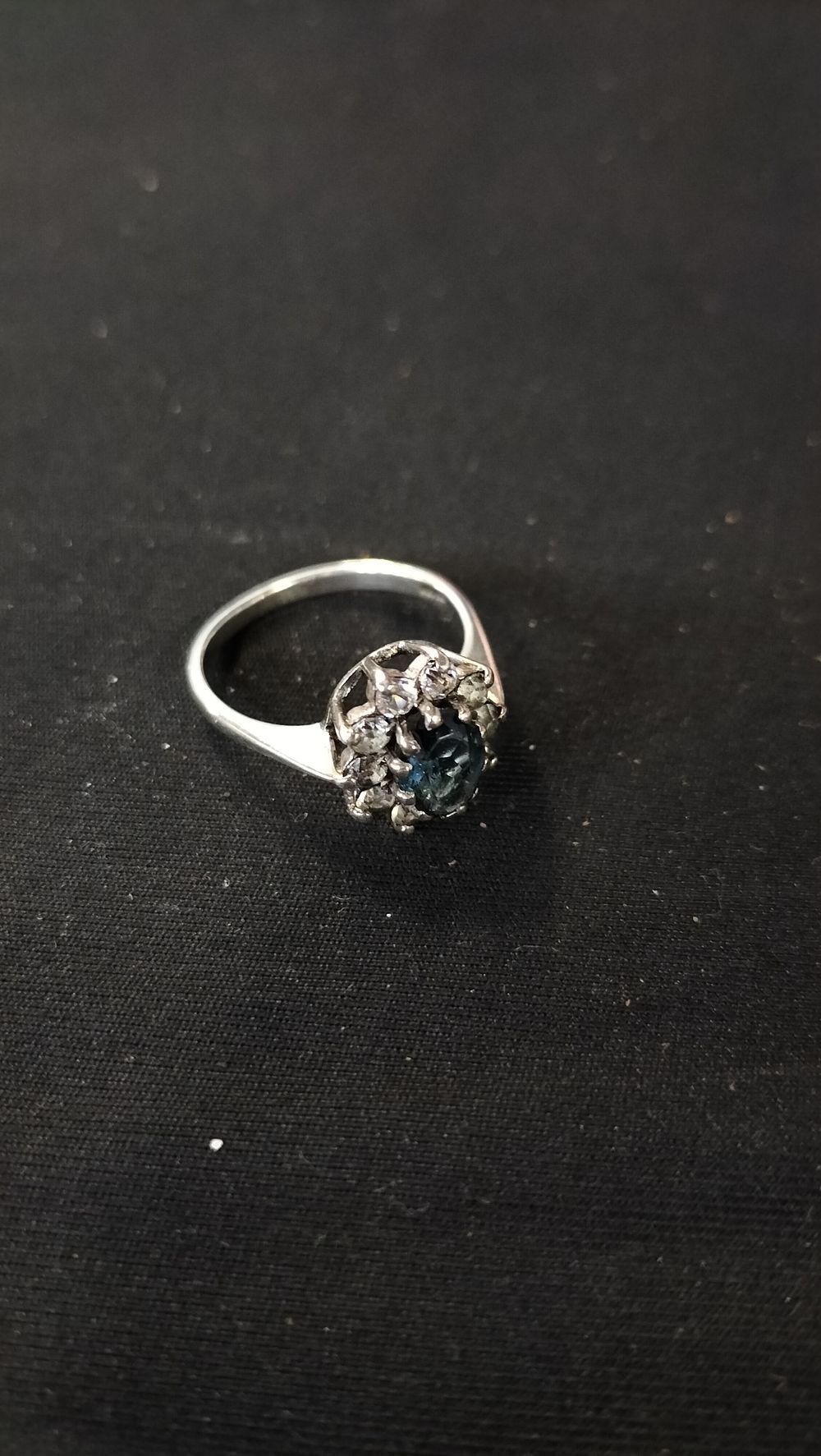 Lot 769: Sterling silver ring with blue central stone and...
