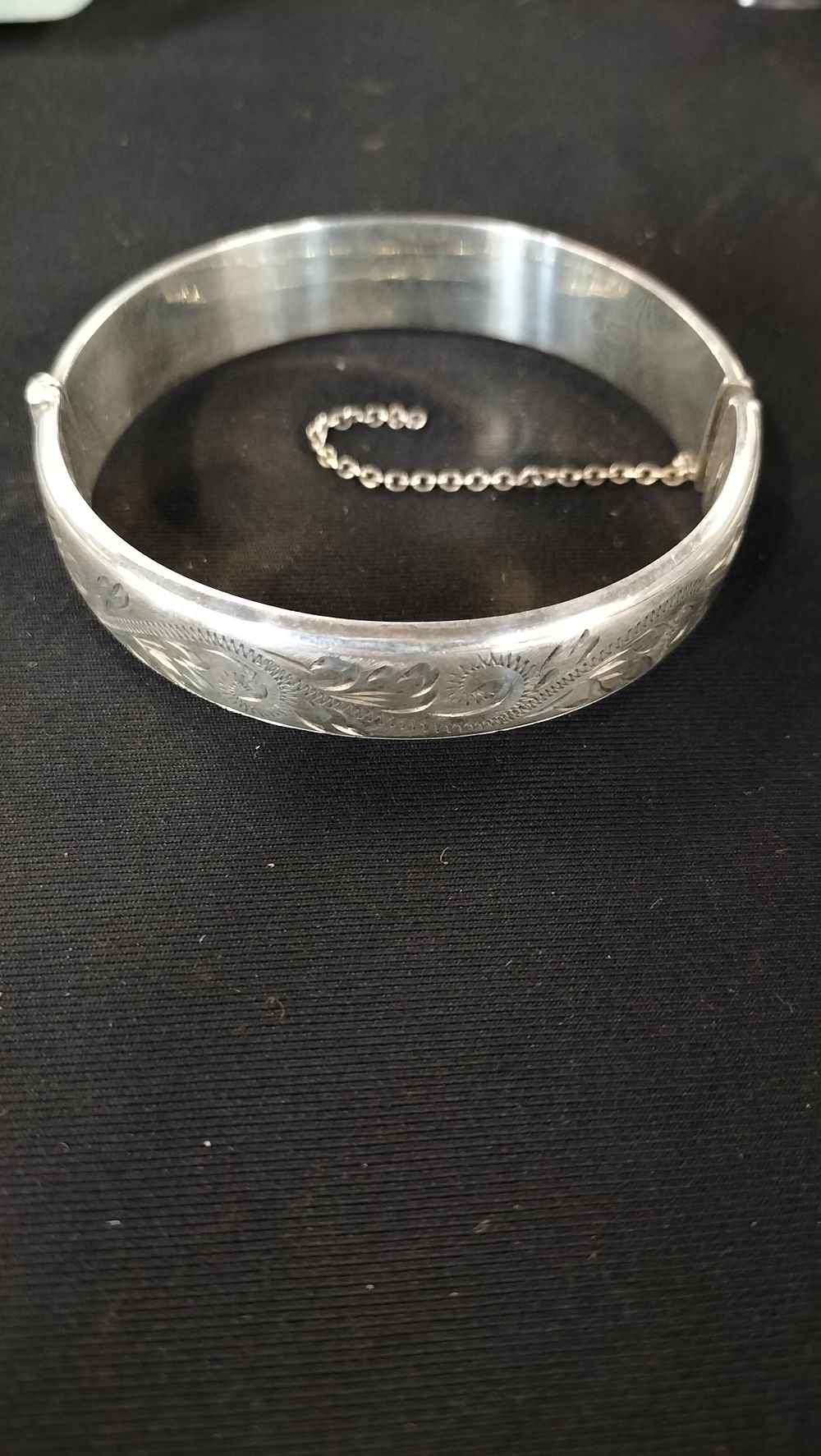 Lot 770: Sterling silver engraved hinges bangle 