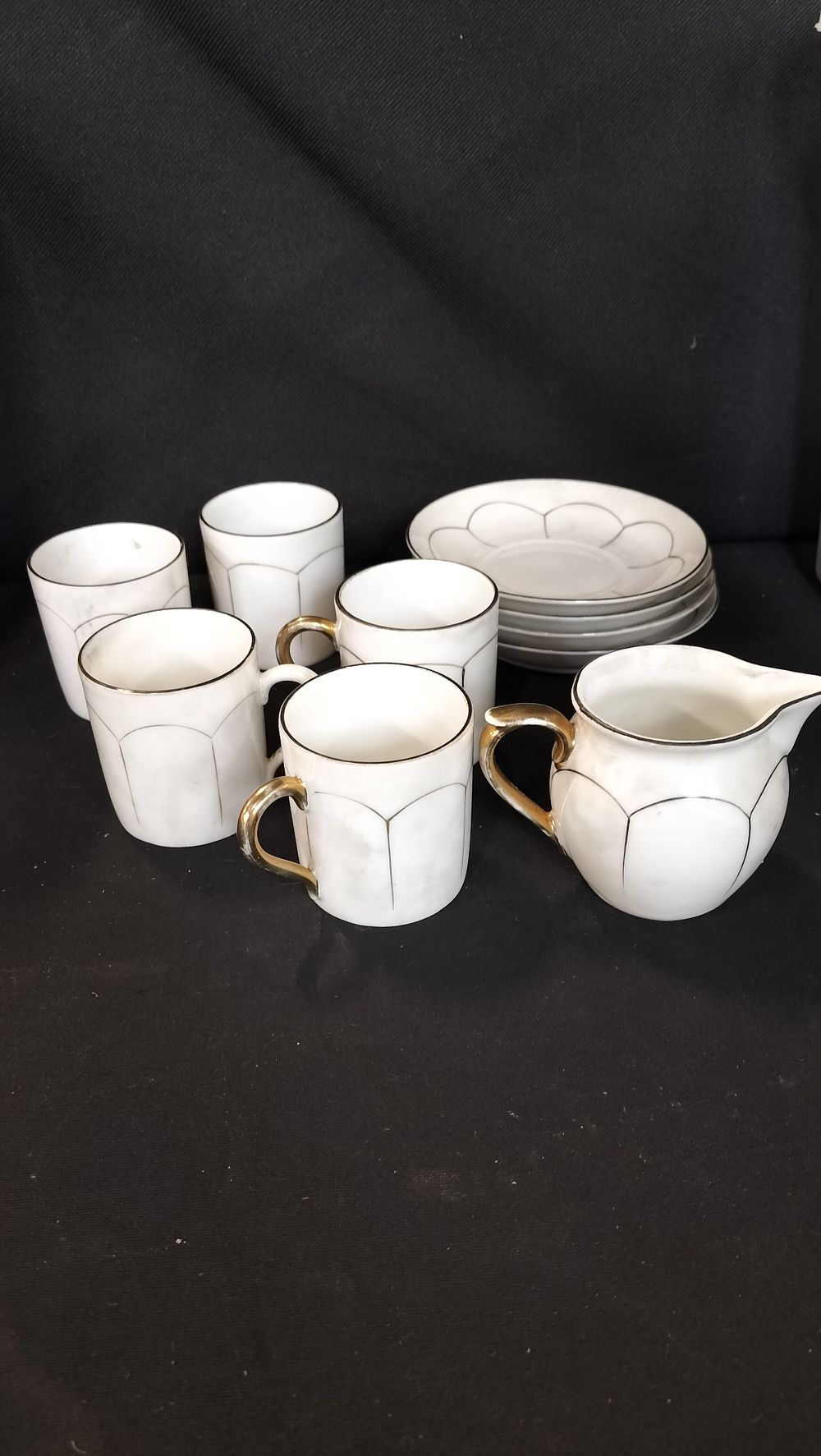 Lot 775: Phoenix china small cups, saucers and milk jug