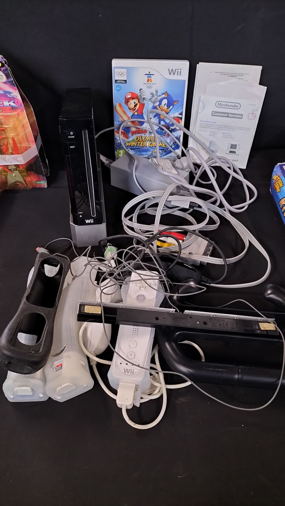 Lot 787: Black Wii console with Mario and Sonic game...