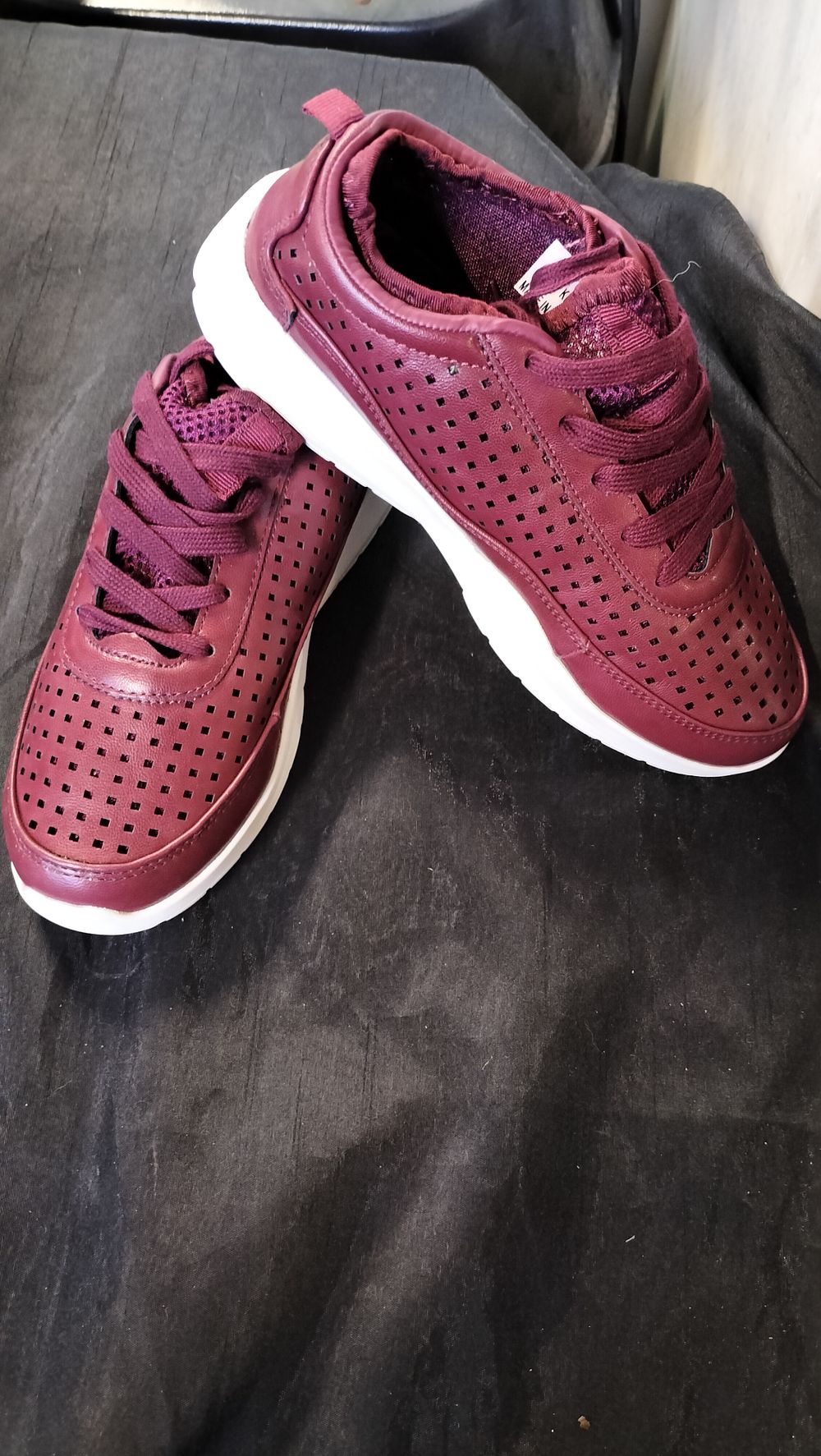 Lot 635: Brand new. Boxed JD Williams burgundy pierced trainers...