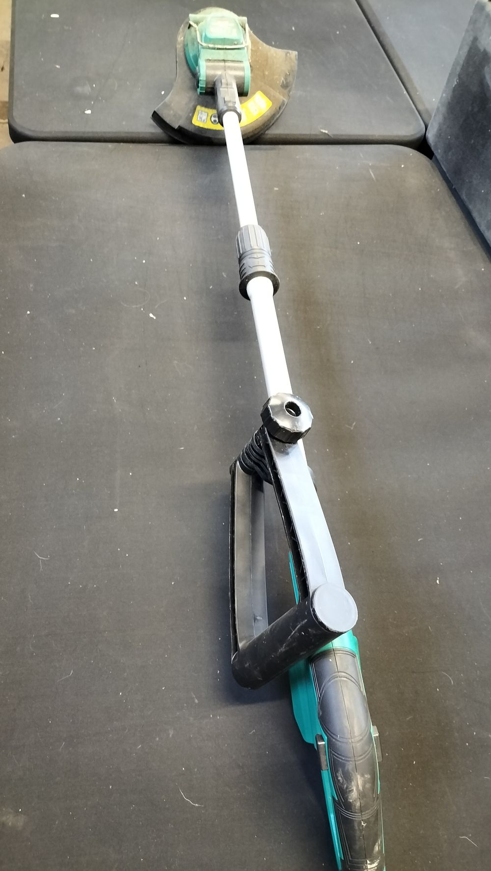 Lot 669: Ferrex 20V battery operated garden strimmer. No Battery....