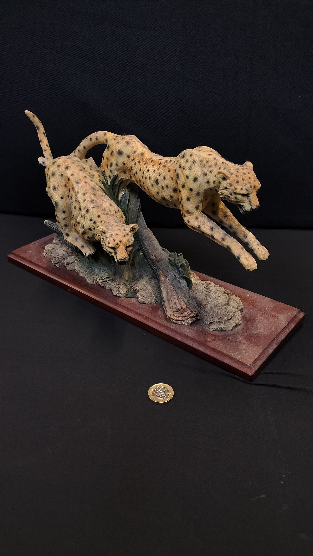 Lot 230: Two Composite Leopards on wooden plinth. Measures approx...