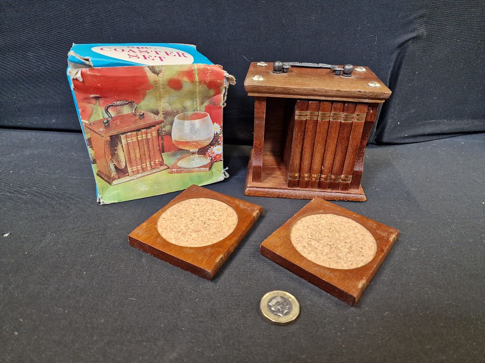 Lot 254: 8pc Coaster Set. Look like Books