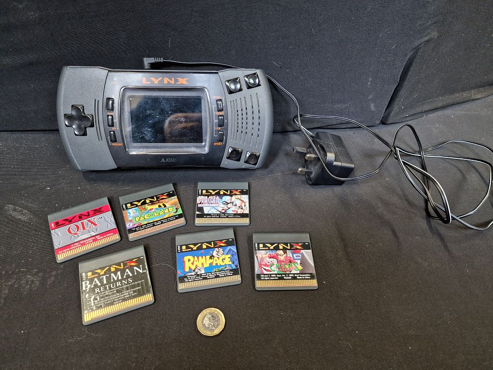 Lot 285: Vintage Atari Lynx Handheld Game System Powers on but is Faulty