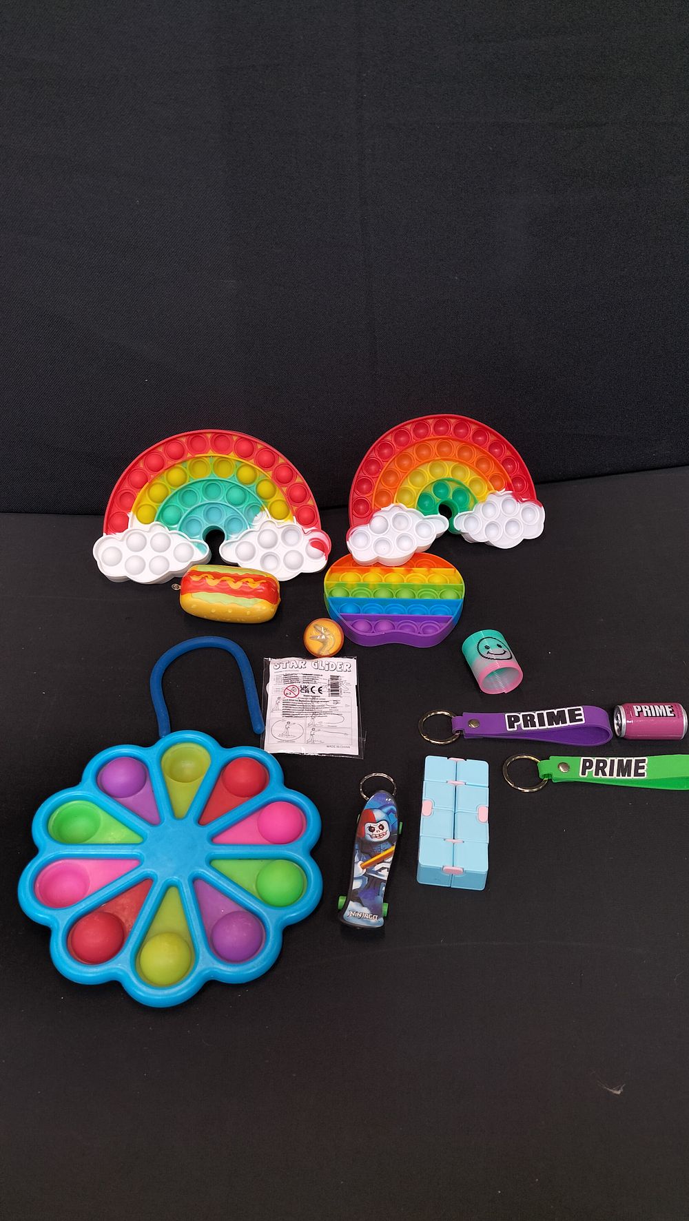 Lot 306: Mixed Lot of Fidget toys and Key Rings 