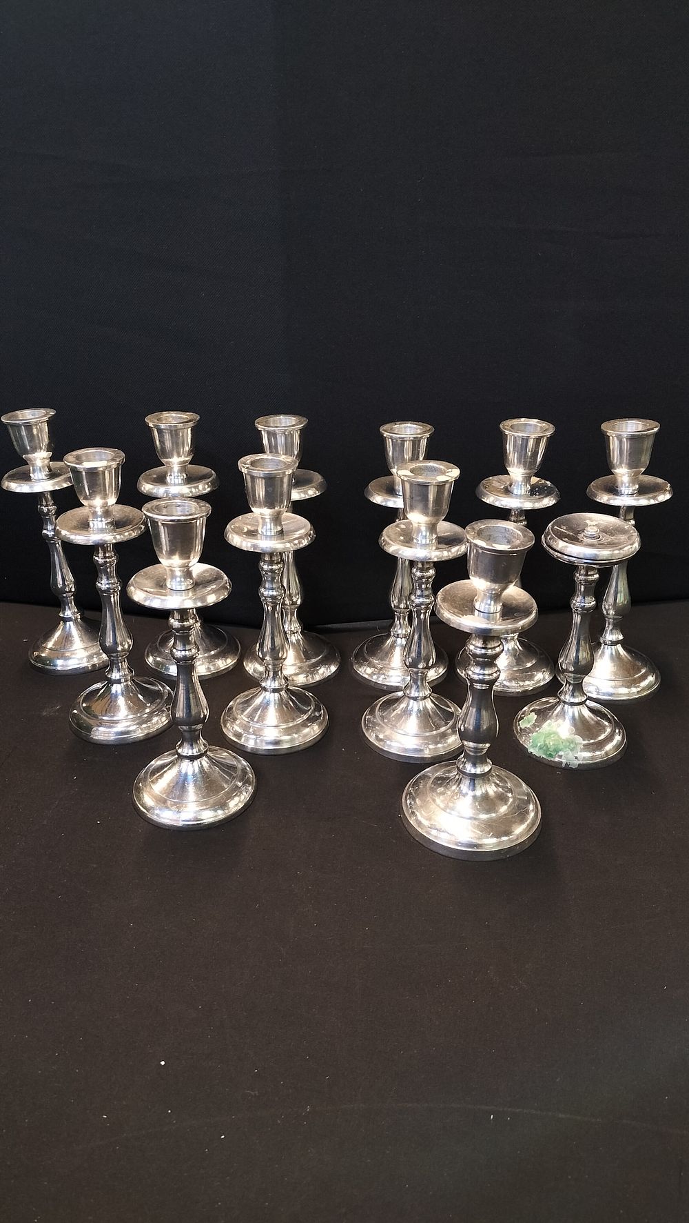 Lot 317: 12 x Silver Tone Candle Sticks. One missing...