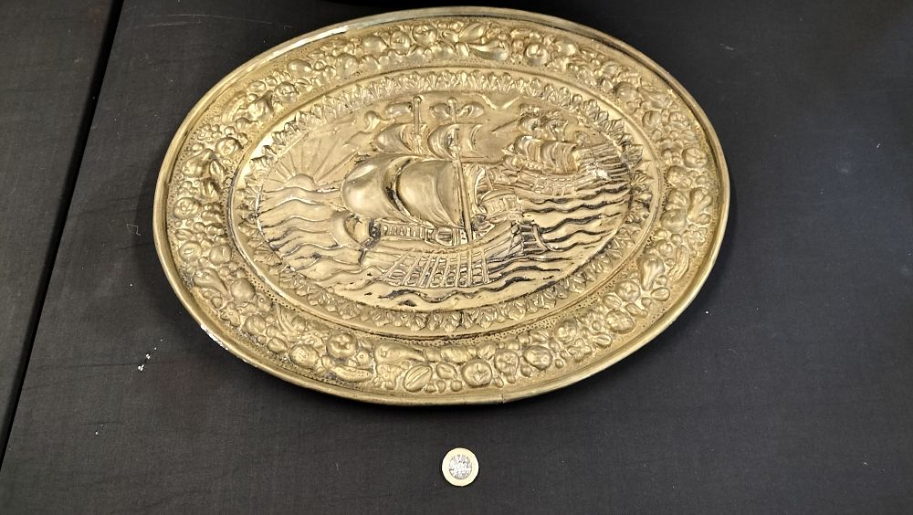 Lot 558: Brass Wall Plate with Ship Decoration 