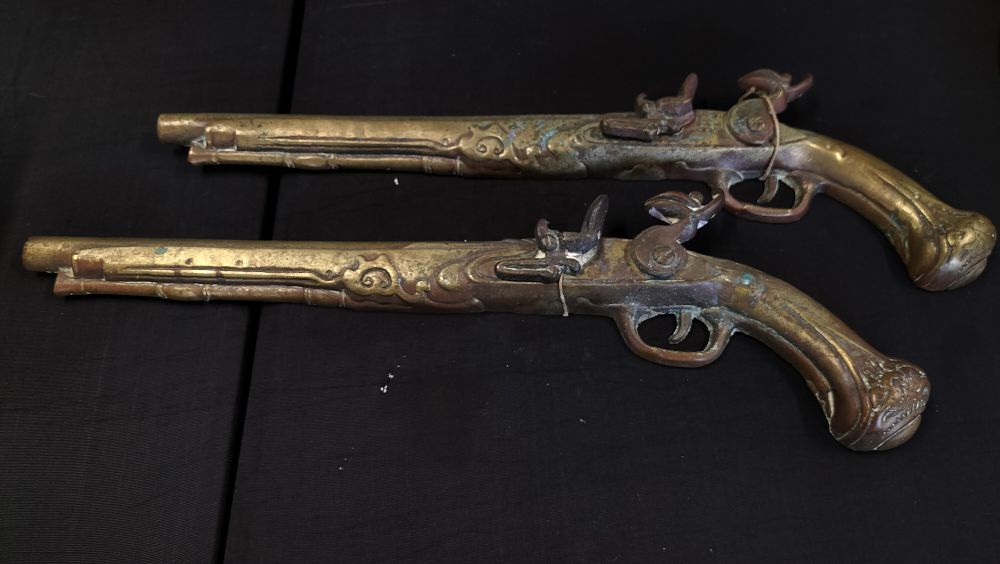 Lot 559: Pair of Brass Wall Pistols 
