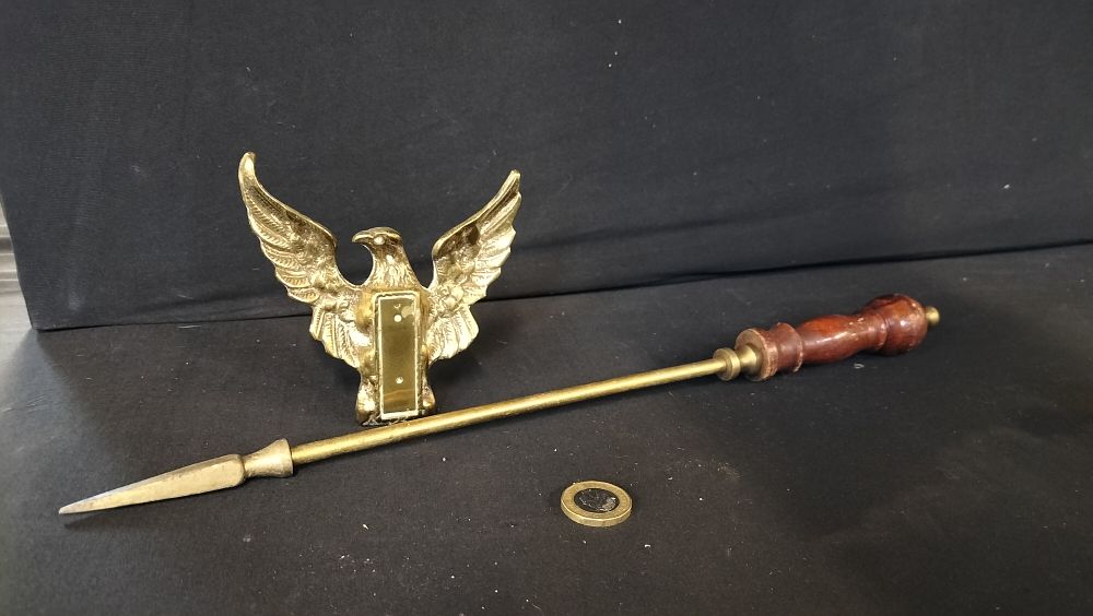 Lot 579:  brass eagle and a poker