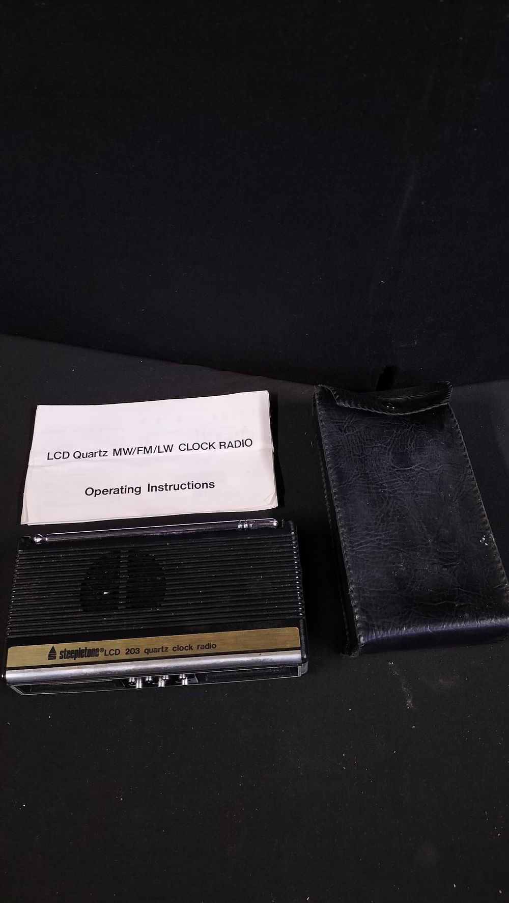 Lot 255: Steeple tone LCD 203 Battery Operated Quartz Clock...
