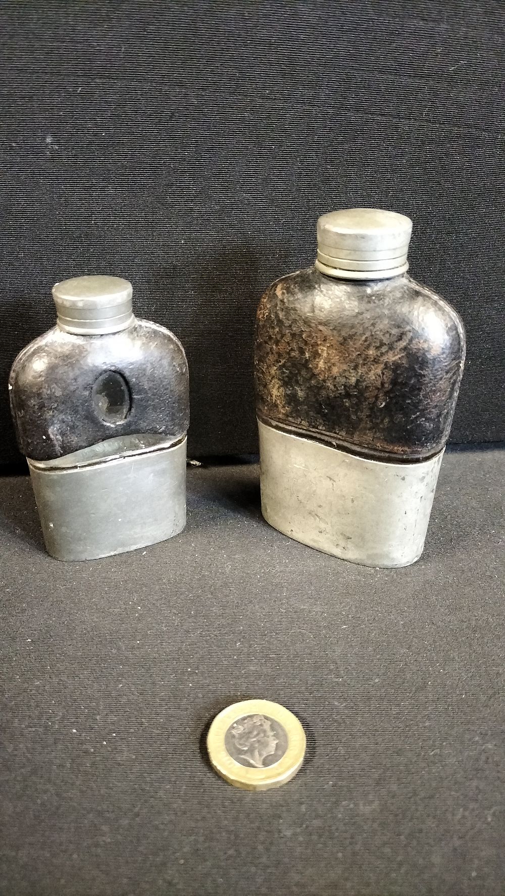 Lot 300: Two Half Leather Hip Flasks 