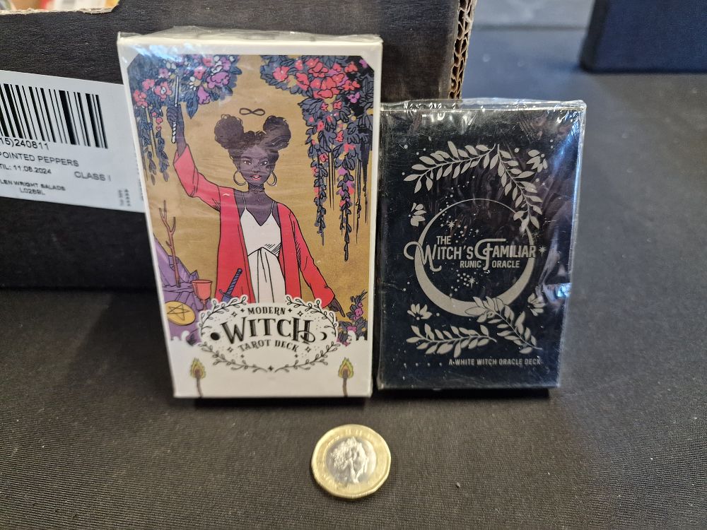 Lot 631: Pair of Tarot Cards. Modern Witch Tarot Deck and The Witchs Familiar Runic Oracle