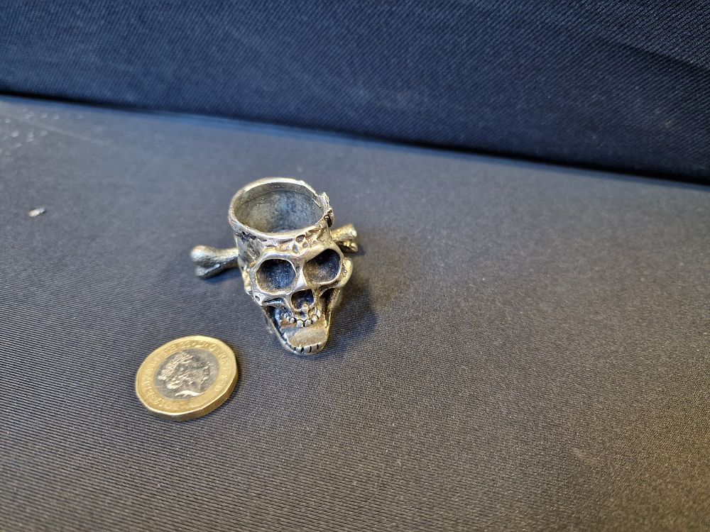 Lot 645: Skull and Bone Crystal Sphere Stand