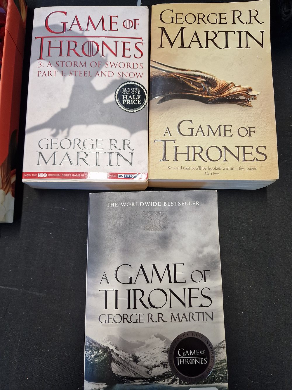 Lot 731: Three A Game of Thrones Paperbacks by George R R Martin