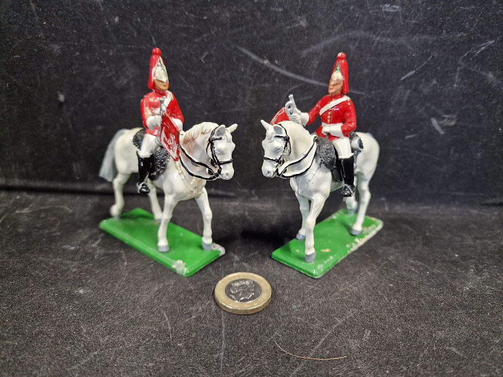 Lot 761: Pair of Britains Metal Guards and Horses Play Worn