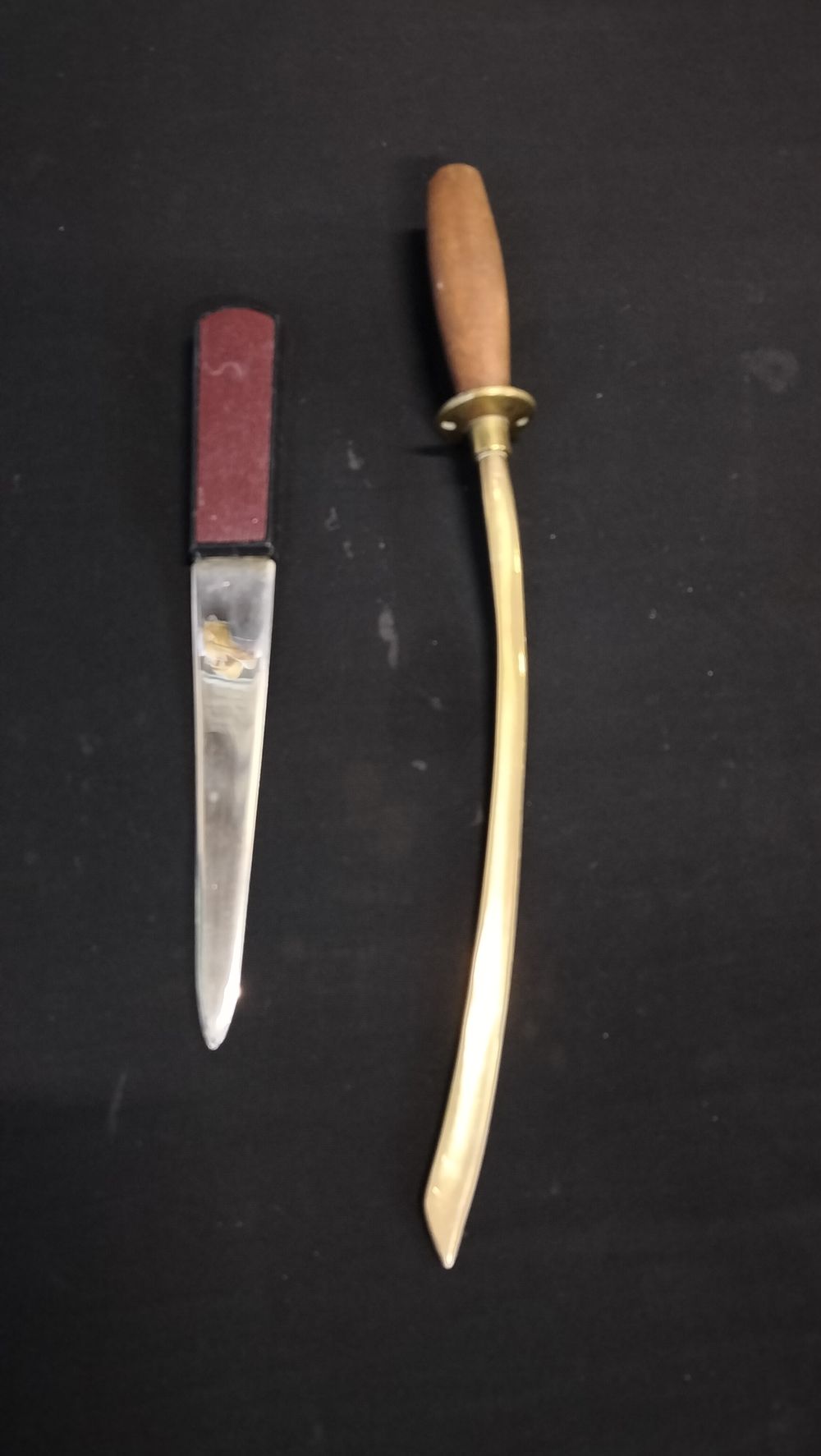 Lot 775: Two ornamental letter openers. One brass and wood 