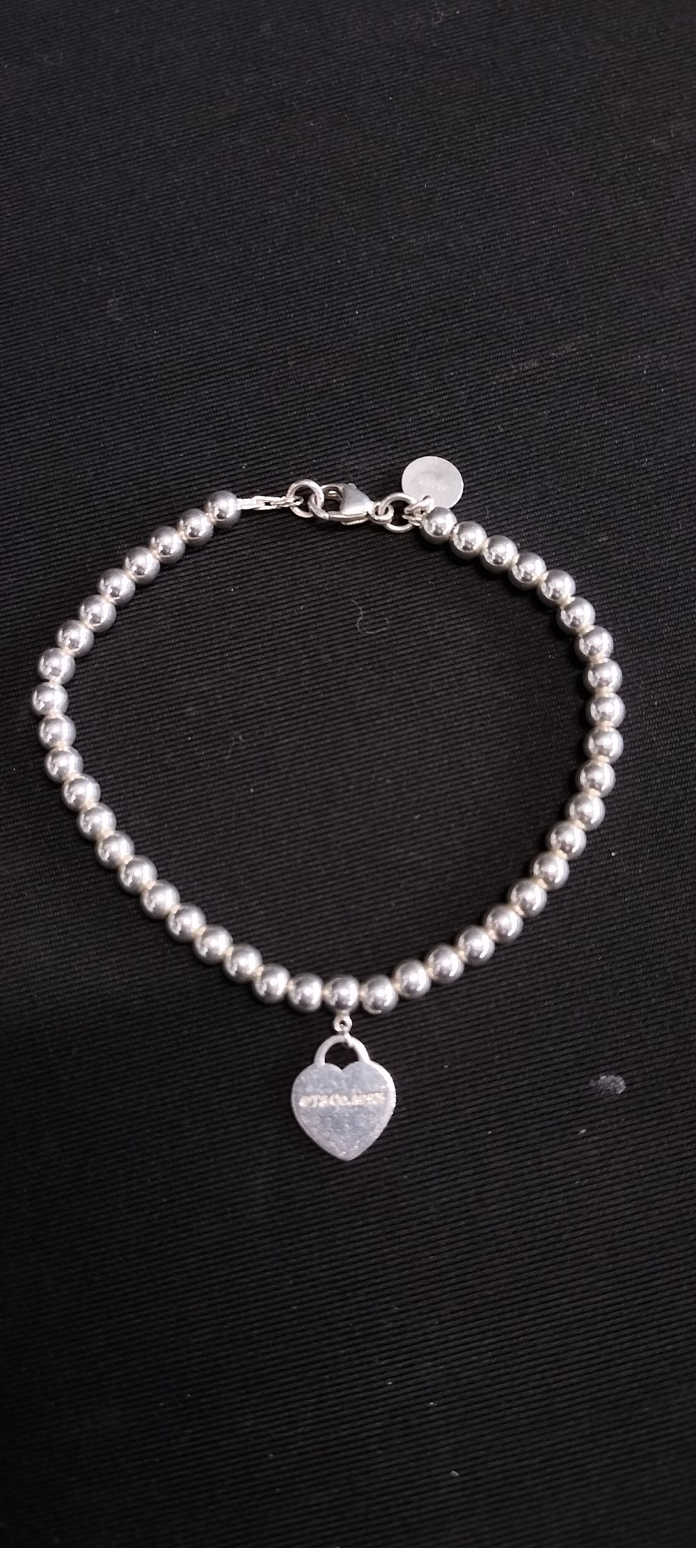 Lot 154: Tiffany & Co. Return to Tiffany Heart Tag...