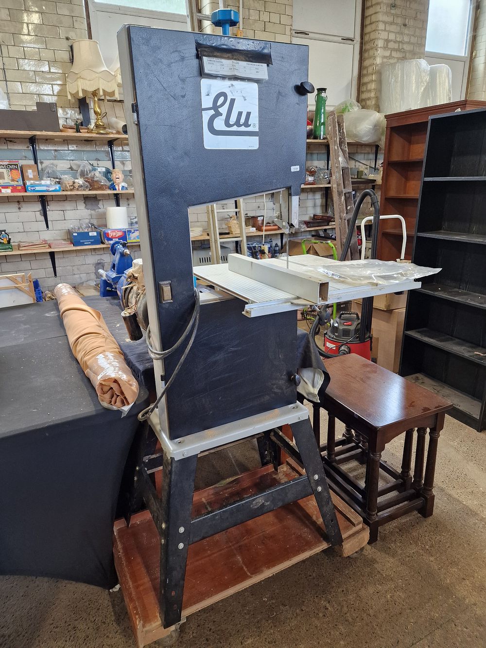 Lot 201: Elu Bandsaw on Stand with Fence and Spare...