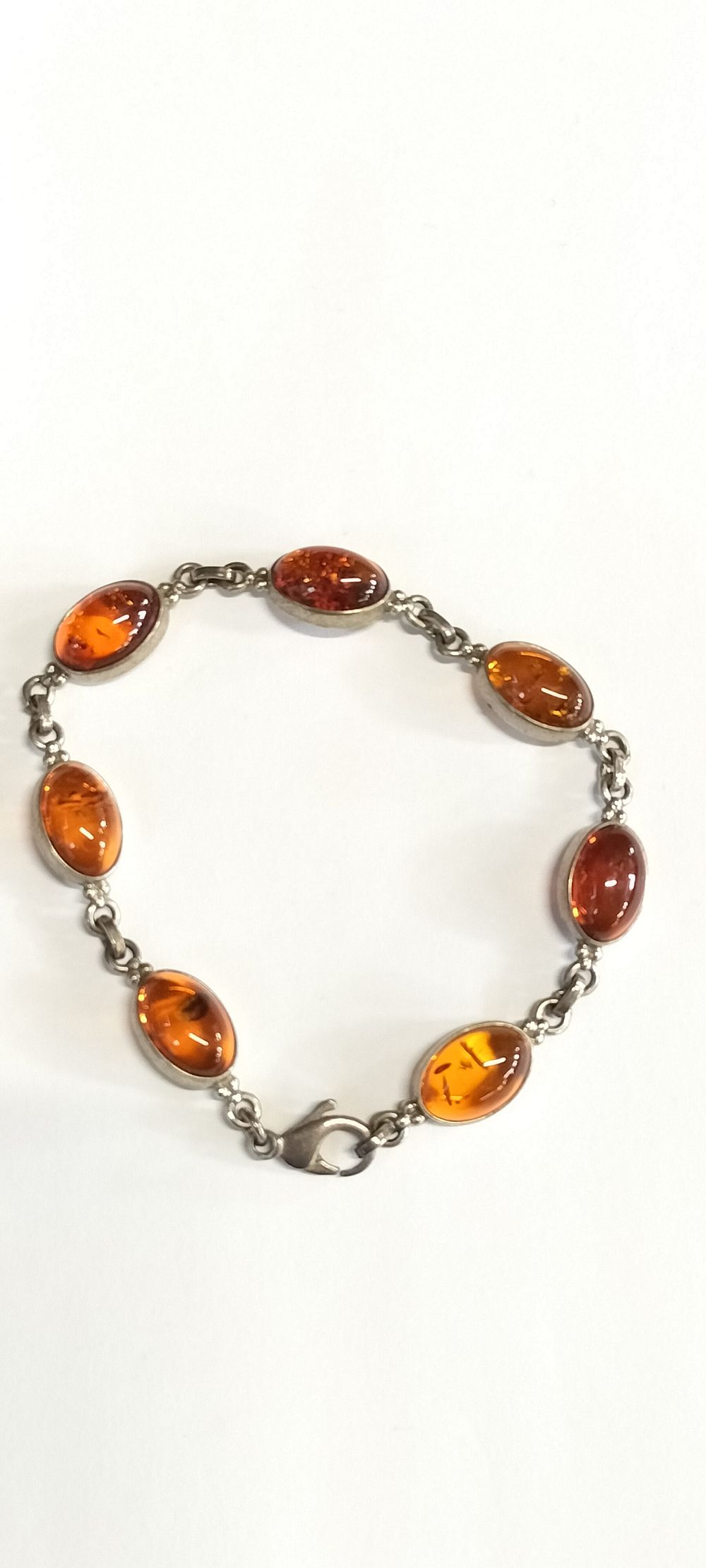 Lot 175: Sterling Silver and Amber Bracelet