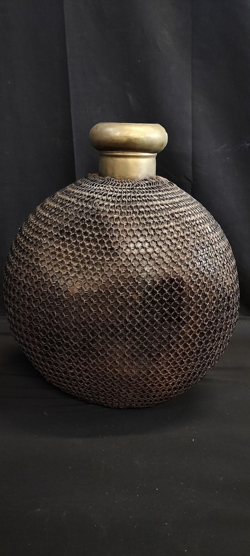 Lot 240: Large Vintage Chainmail Bound Brass Bottle Vase. Measures...