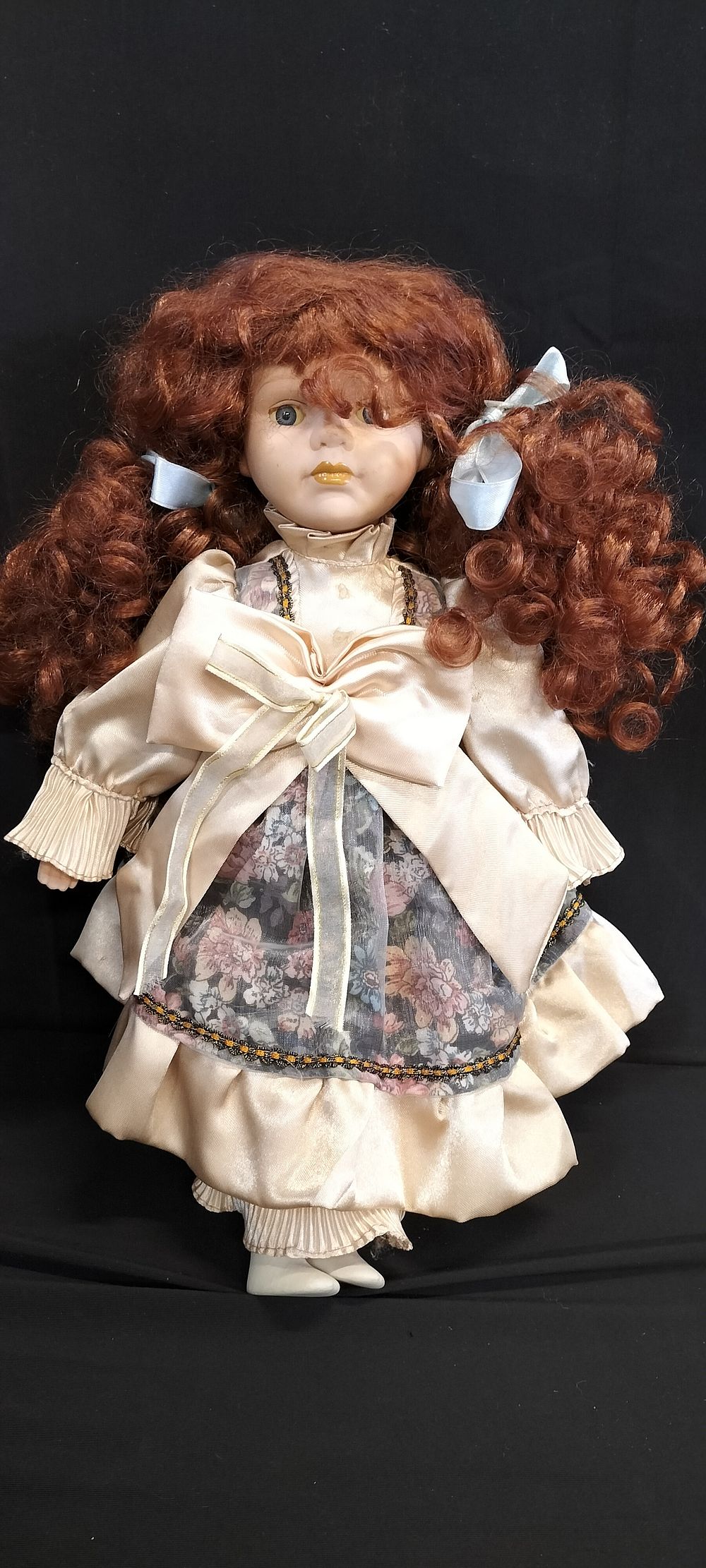 Lot 255: Vintage Porcelain Doll, with Sateen dress. Measures approx...