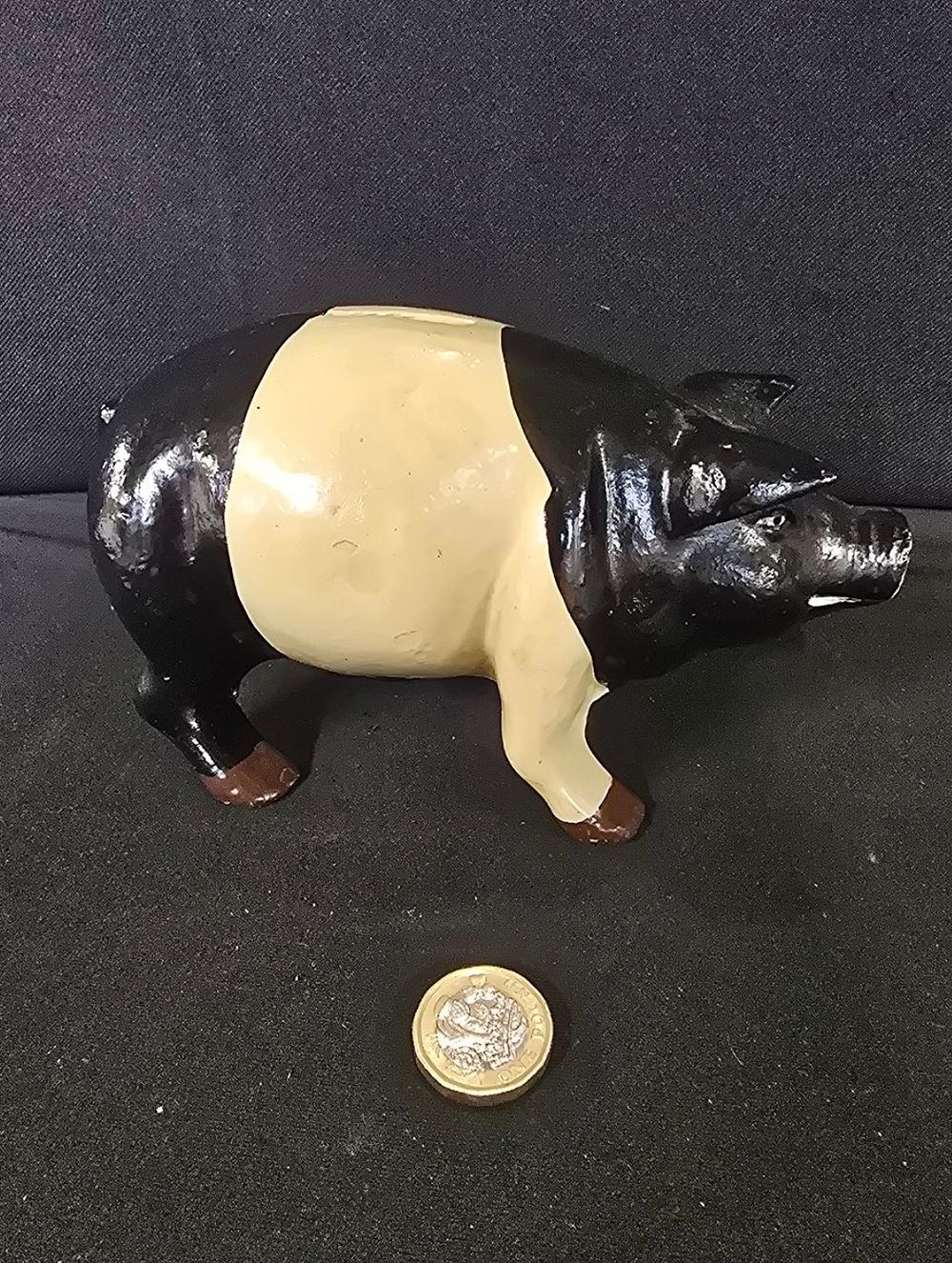 Lot 289: Cast iron black and cream cast iron money...