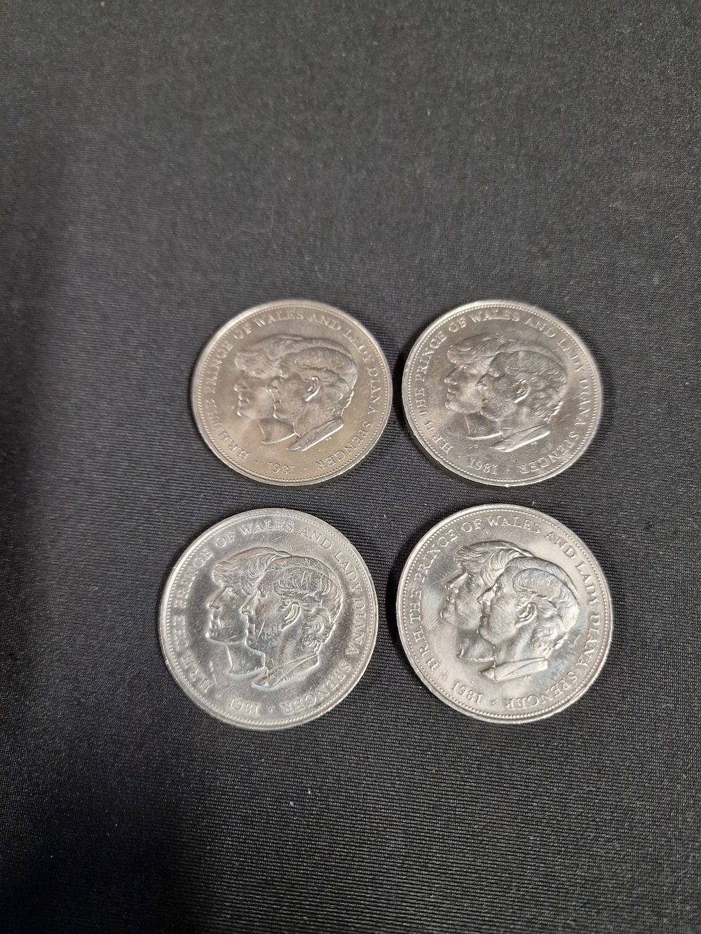 Lot 554: Four Vintage British 1981 Charles and Diana Crown Coins