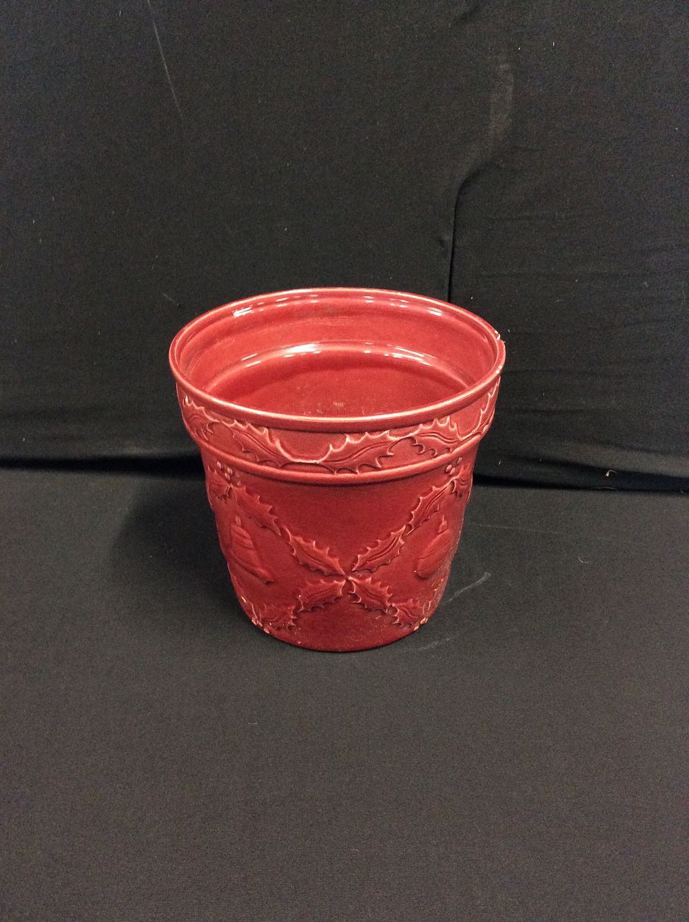 Lot 562: Red Planter Pot with Holly and Christmas decoration...