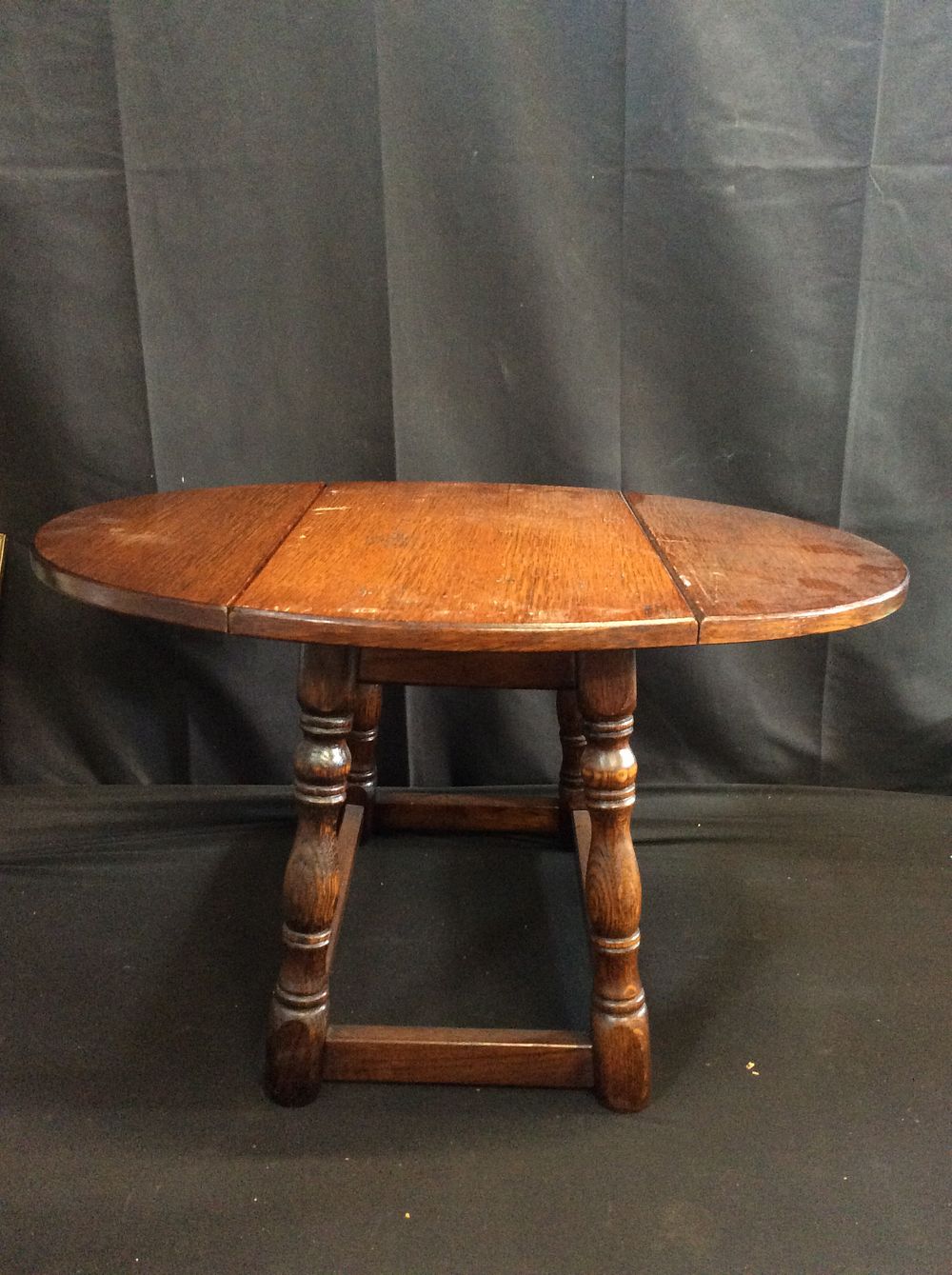 Lot 632: Small Drop Leaf Table. Measures approx 39 x...