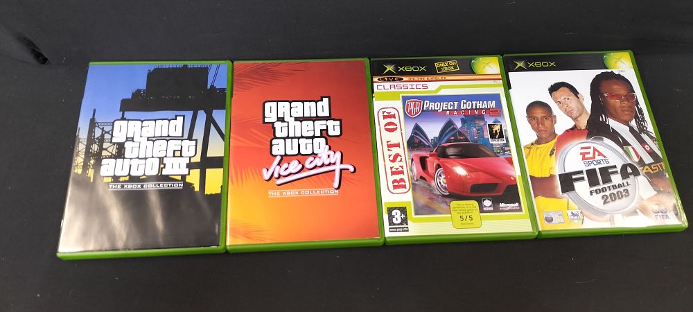 Lot 165: Four X-Box Games. Grand Theft Auto III, Grand...
