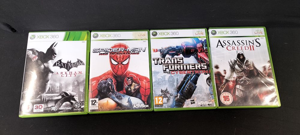 Lot 166: Four X-Box 360 Games. Batman Arkham City, Spider-Man...