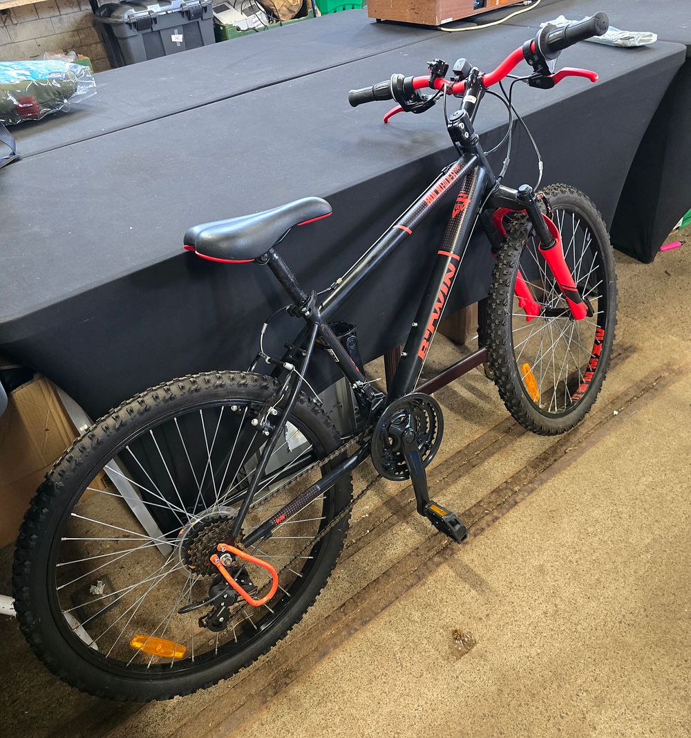 Lot 252: Like new Rockrider 500 mountain bike in black and orange