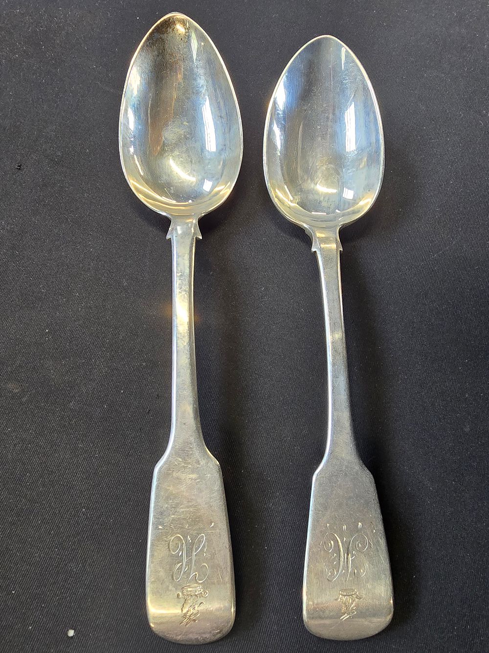 Lot 277: Two hallmarked sterling silver serving spoons with monogram