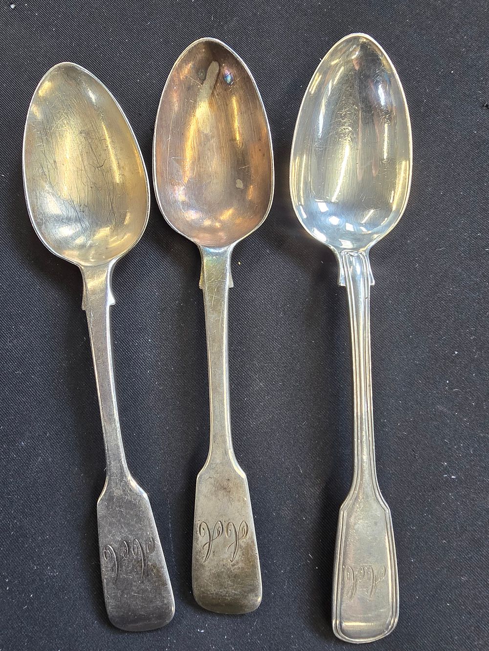 Lot 285: Three hallmarked sterling silver desert spoons. Monogramed. Approximately 150g
