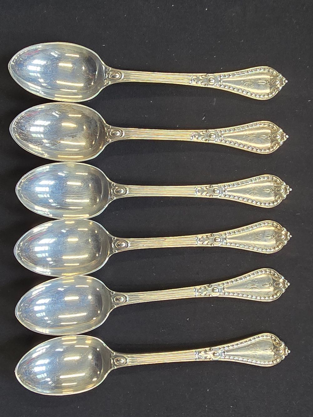 Lot 300: Six sterlingnsilver hallmarked desert / tea spoons with monogram H