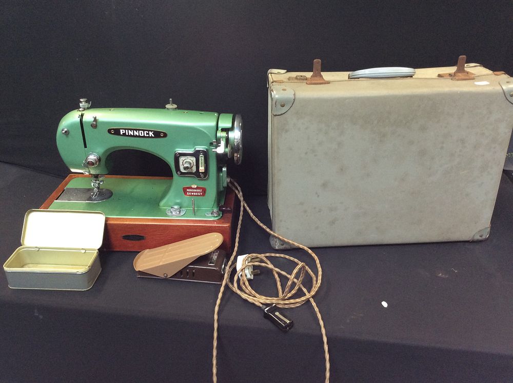 Lot 570: Vintage Electric Pinnock Sewing Machine, with Carry Case....