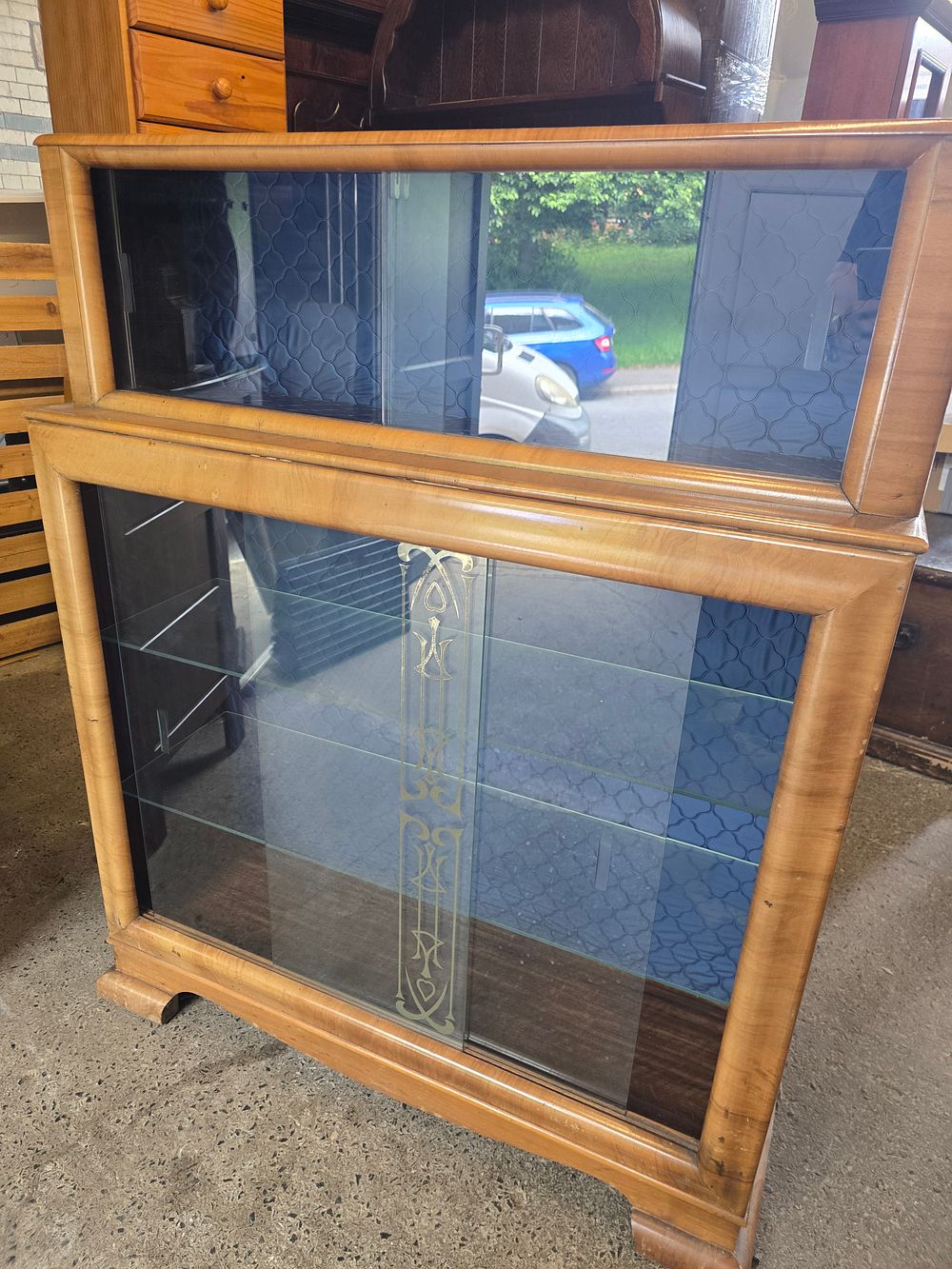 Lot 717: A vintage wooden andnglass display unit