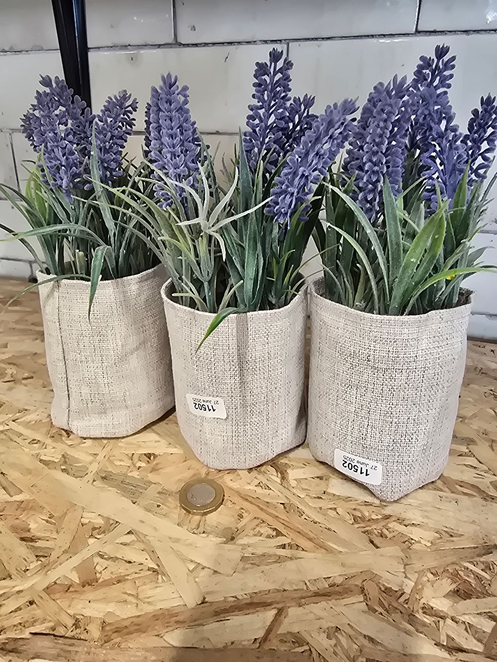 Lot 719: Three artificial lavender plants