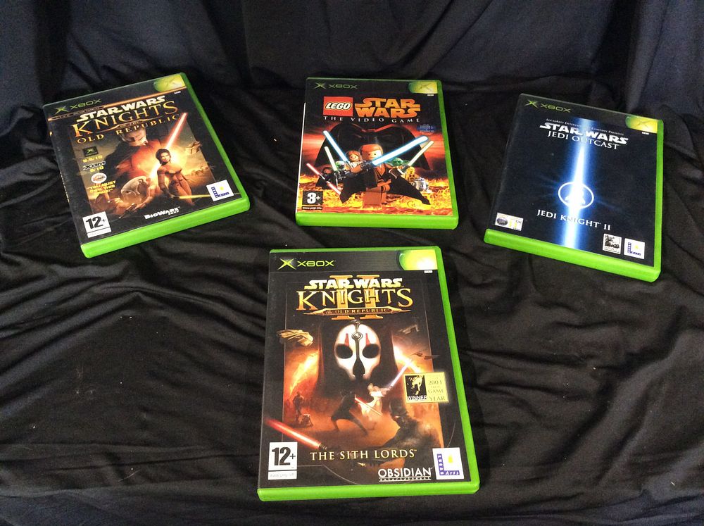 Lot 764: Four Xbox Games. Star Wars Knights of the...